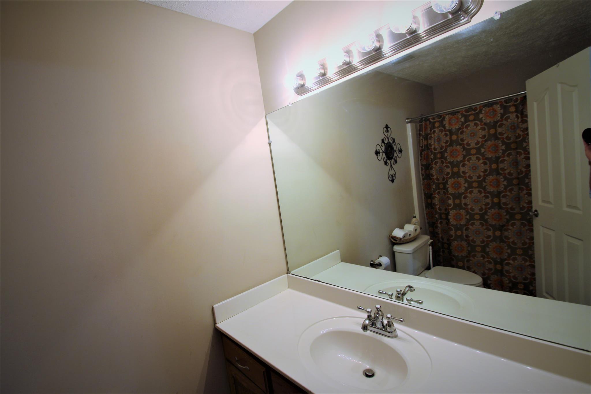 37 Ferrells Loop Road Manchester, TN 37355 - Photo 15 of 18 a bathroom with a sink and a mirror