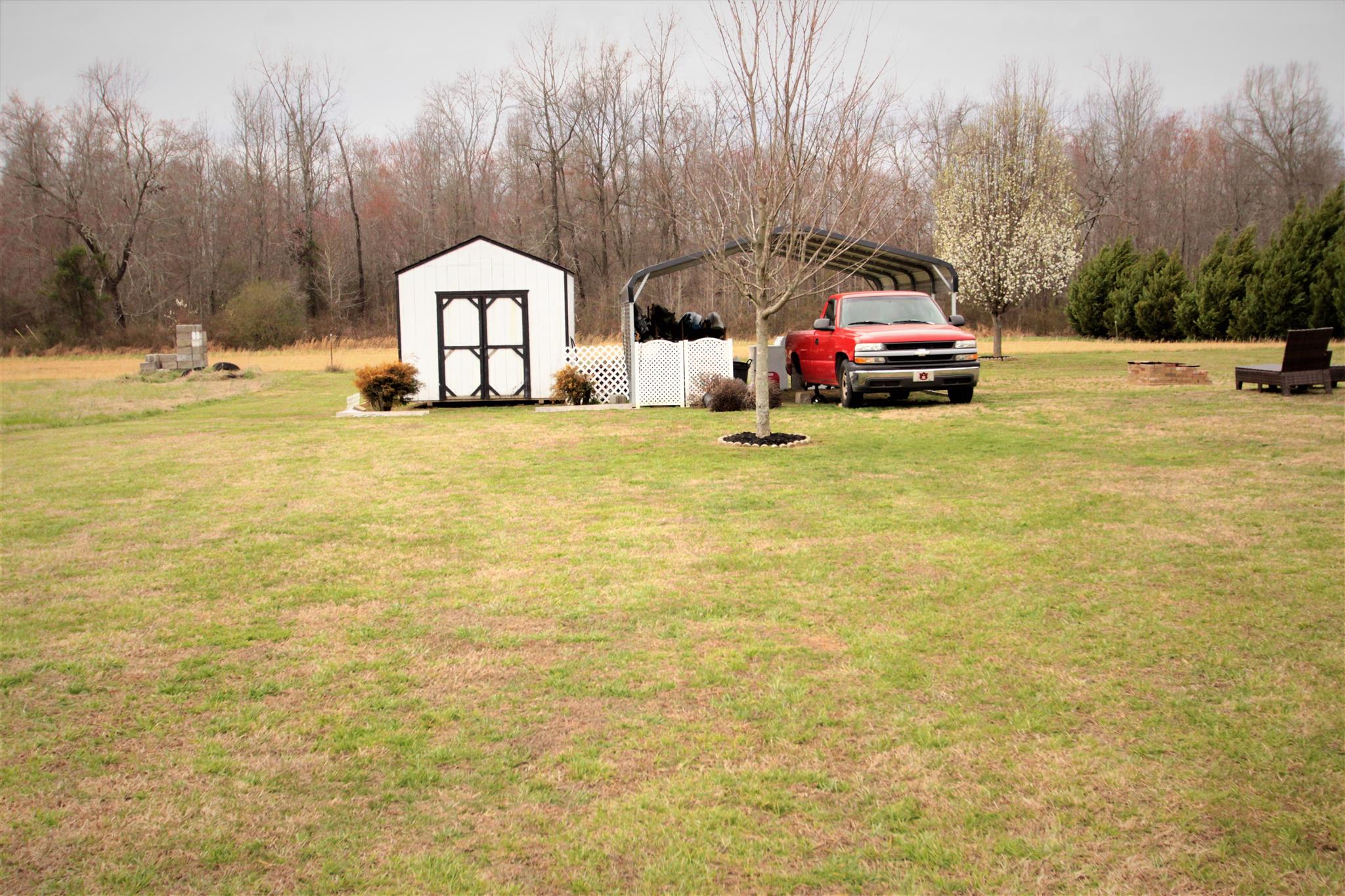 37 Ferrells Loop Road Manchester, TN 37355 - Photo 16 of 18 a car parked in front of a house with yard