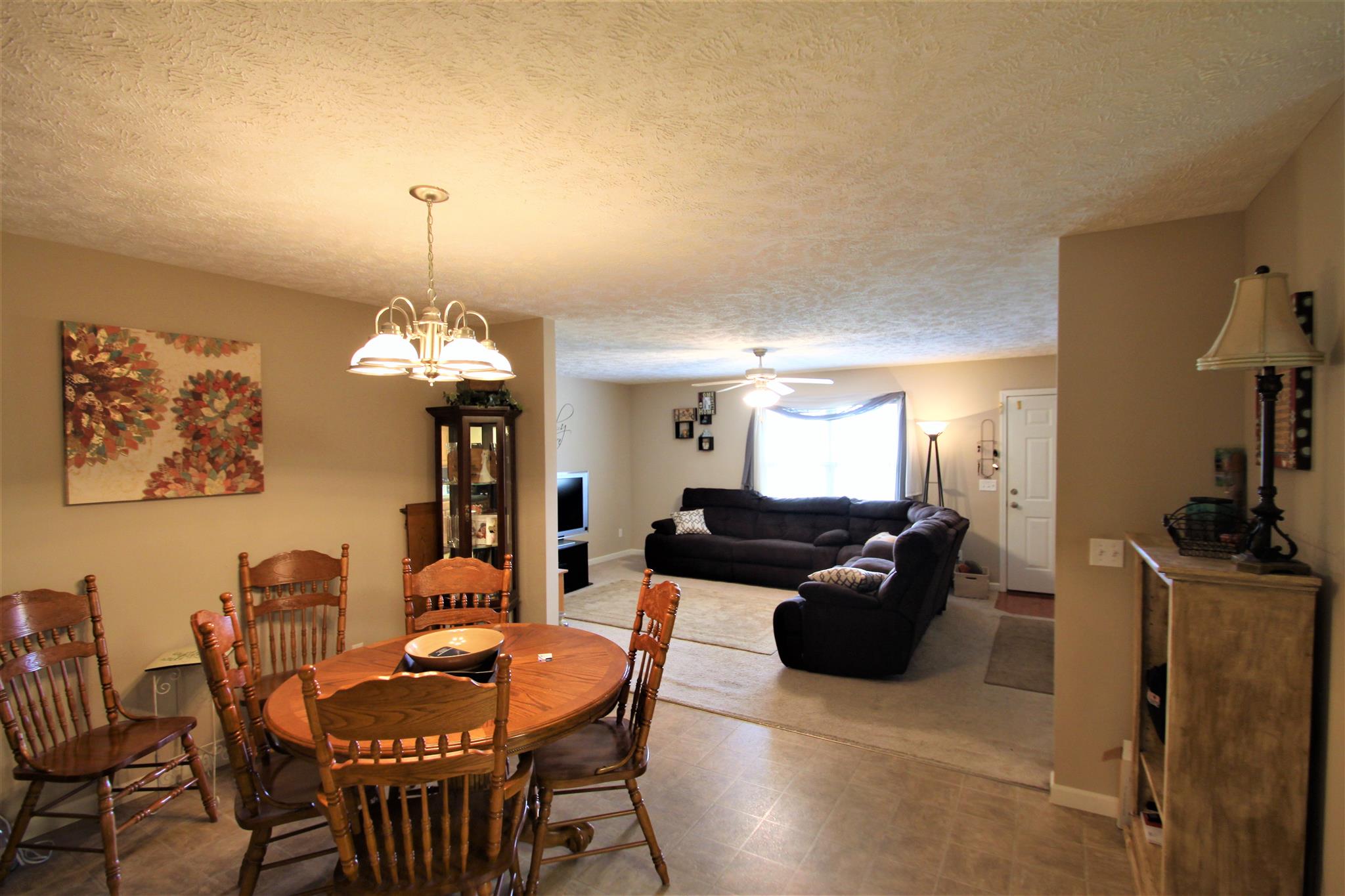 37 Ferrells Loop Road Manchester, TN 37355 - Photo 5 of 18 a living room with furniture a chandelier and a flat screen tv
