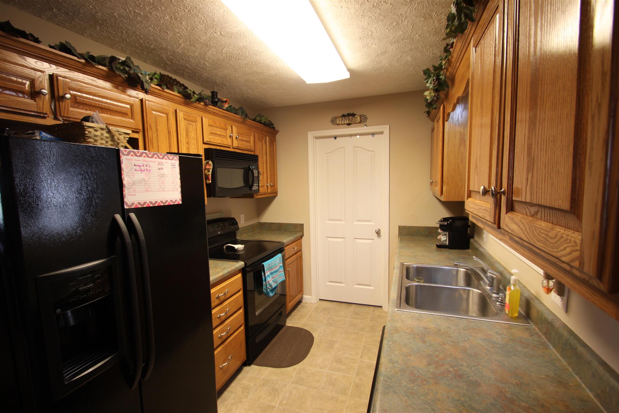 37 Ferrells Loop Road Manchester, TN 37355 - Photo 7 of 18 a kitchen with stainless steel appliances granite countertop a refrigerator and a stove top oven