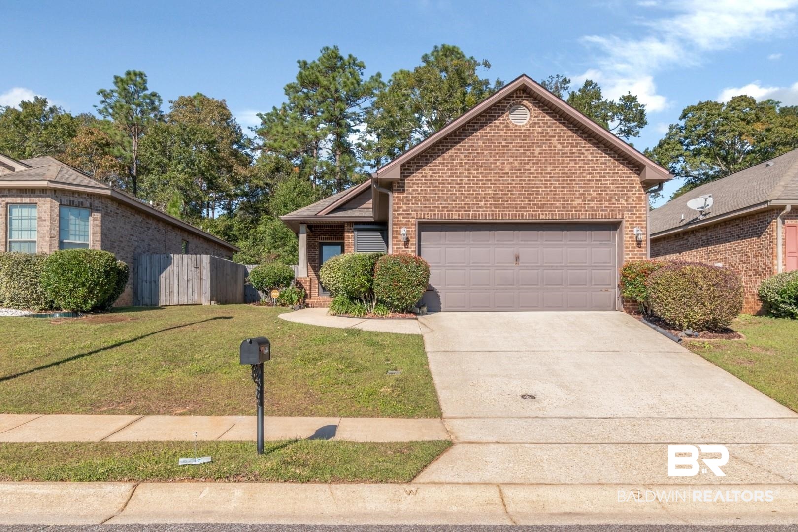 6144 Whitebark Drive Mobile, AL 36693 - Photo 32 of 33 Front facade with a front lawn and a garage