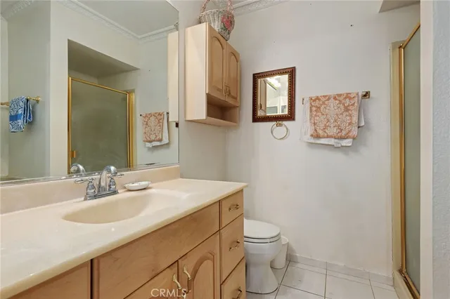 a bathroom with a sink toilet and mirror