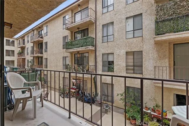 a view of a chair and table in the balcony