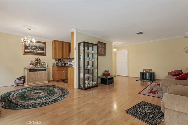 a living room with hard wood flooring and a couch