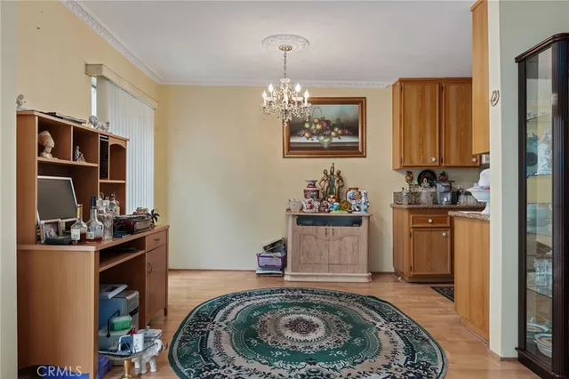 a kitchen with sink stove and refrigerator