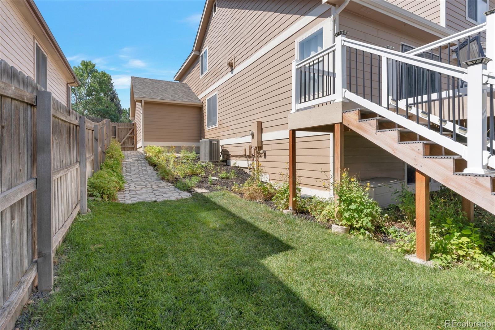 6794 West 98th Circle Westminster, CO 80021 - Photo 38 of 43 a house view with a garden space
