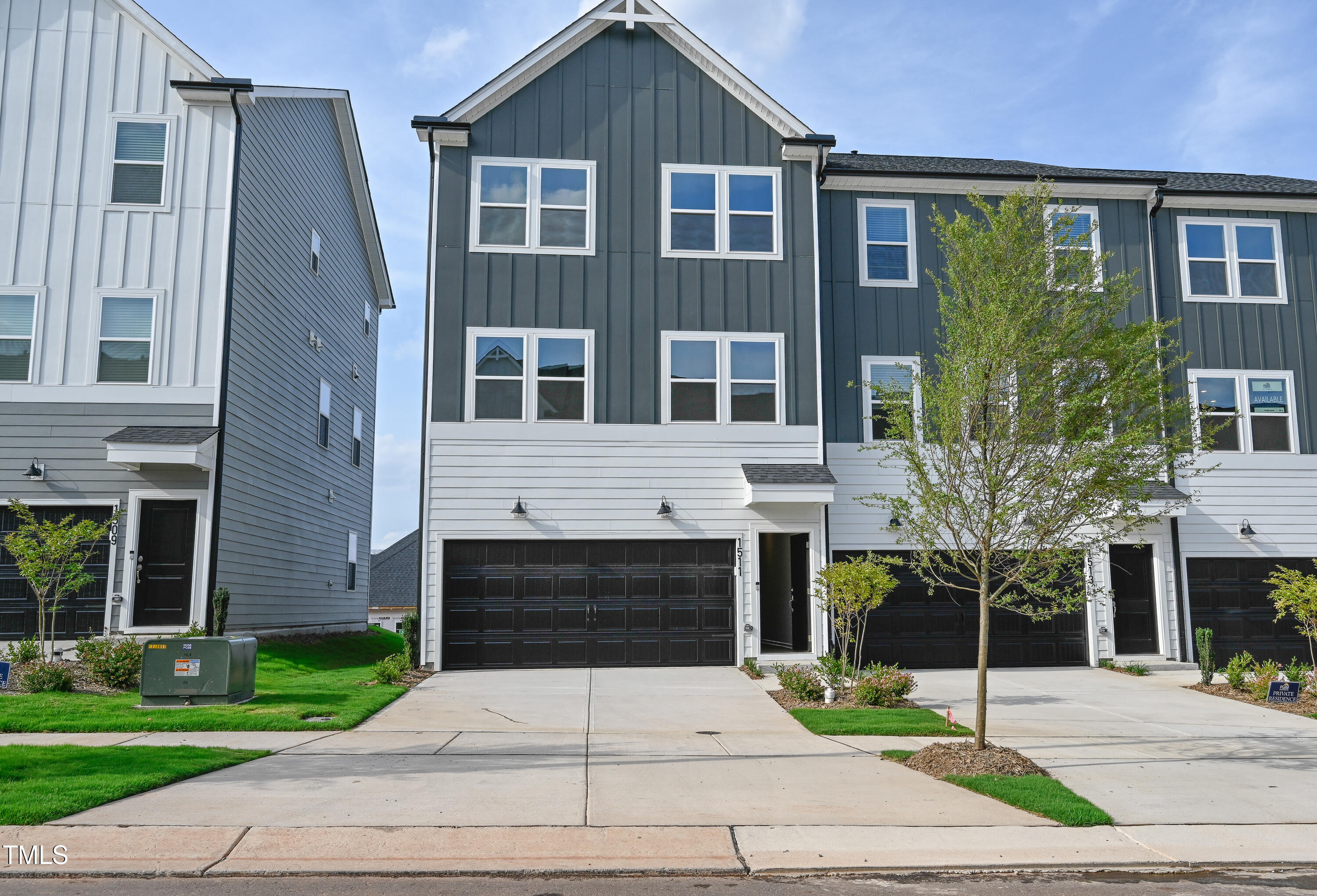 1511 Tamarisk Lane Durham, NC 27703 - Photo 1 of 26 a front view of a house with garden