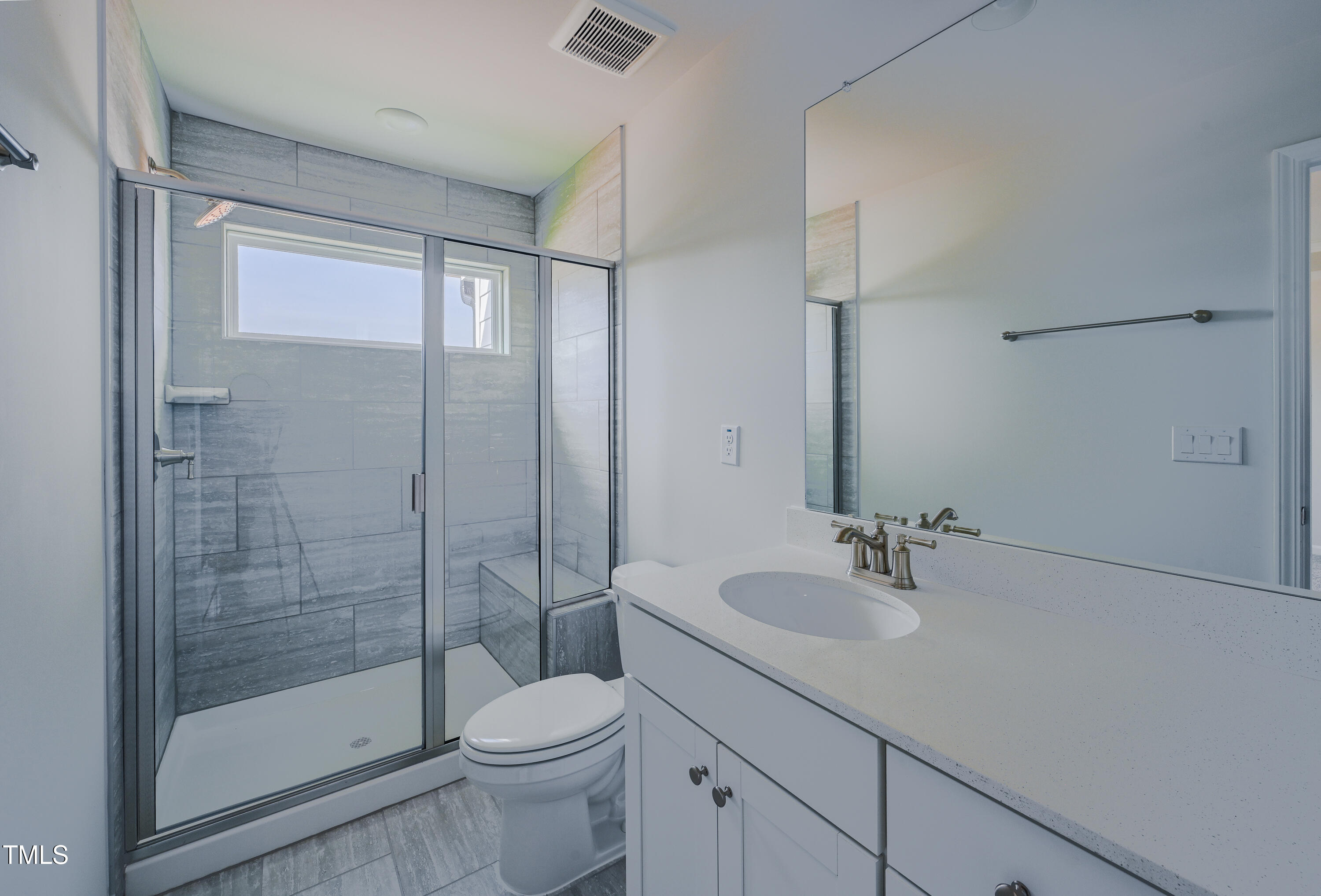 1511 Tamarisk Lane Durham, NC 27703 - Photo 22 of 26 a bathroom with a sink toilet and shower