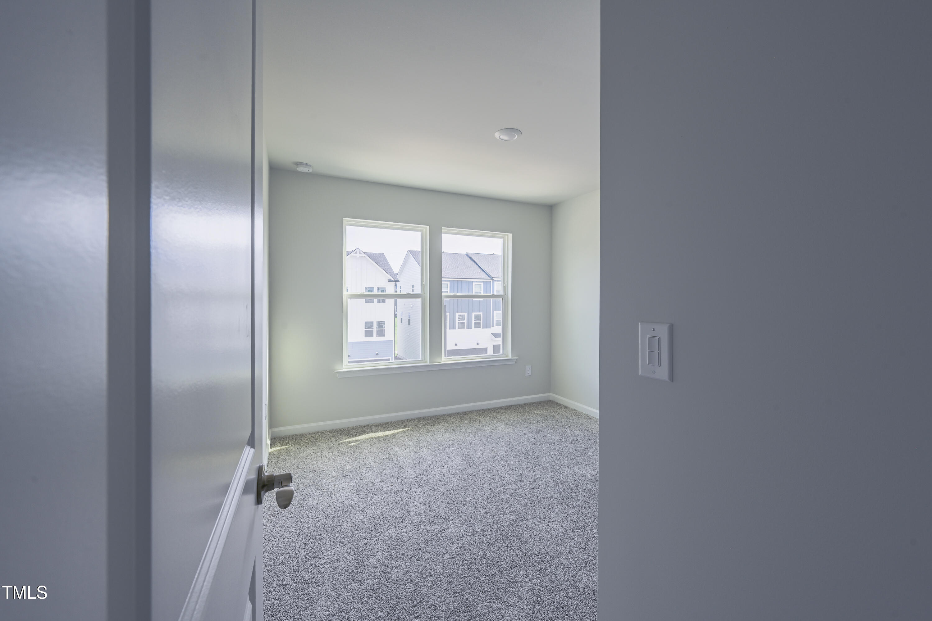 1511 Tamarisk Lane Durham, NC 27703 - Photo 23 of 26 a view of an empty room with a window