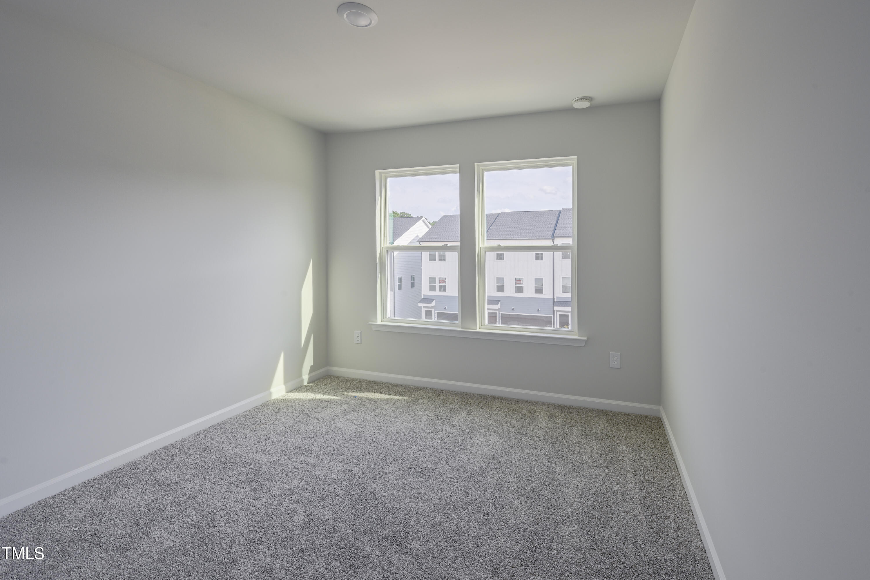 1511 Tamarisk Lane Durham, NC 27703 - Photo 24 of 26 an empty room with a window