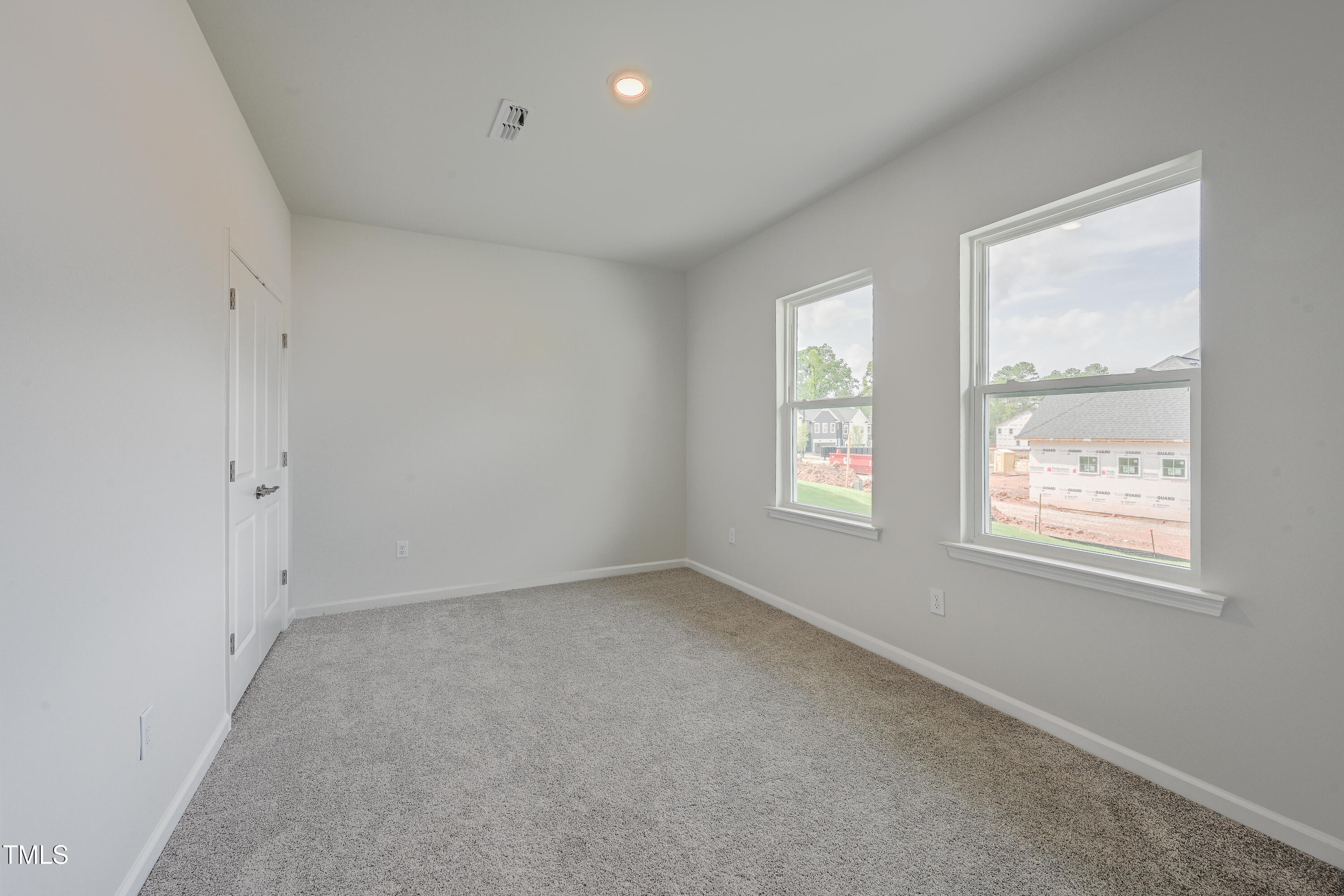 1511 Tamarisk Lane Durham, NC 27703 - Photo 7 of 26 an empty room with windows