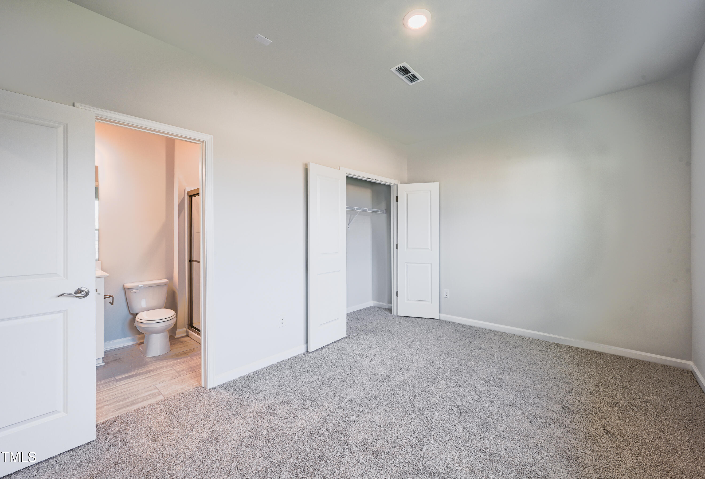 1511 Tamarisk Lane Durham, NC 27703 - Photo 8 of 26 a big room with closet and a toilet