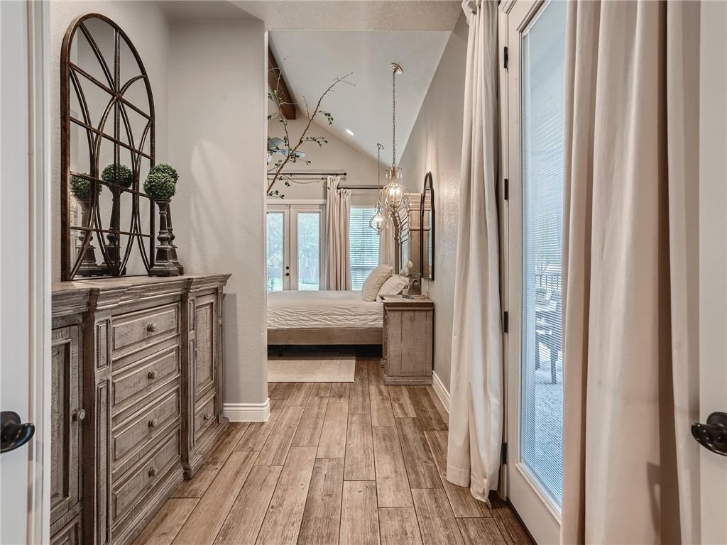 132 Huerta Road Florence, TX 76527 - Photo 12 of 40 Natural light pours into this peaceful bedroom, boasting high ceilings and wood flooring.