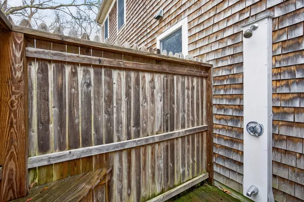 a kitchen with a sink a counter top space and stainless steel appliances