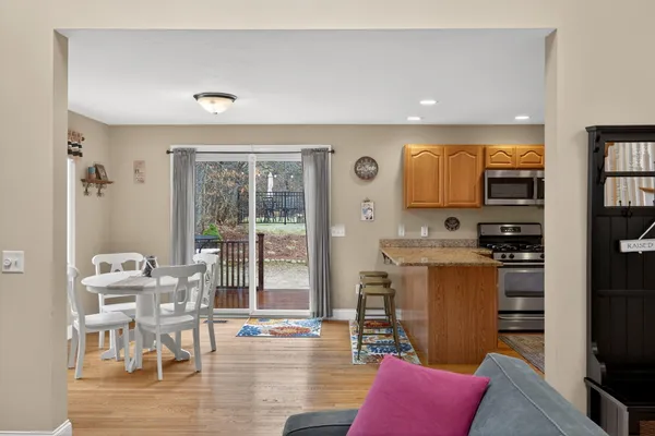 a bedroom with furniture and wooden floor