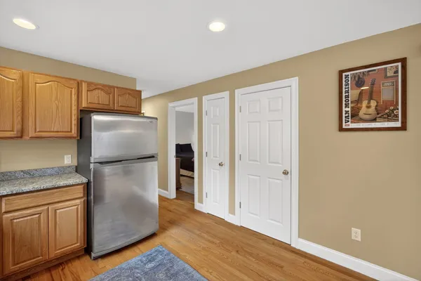 a living room with furniture and a ceiling fan