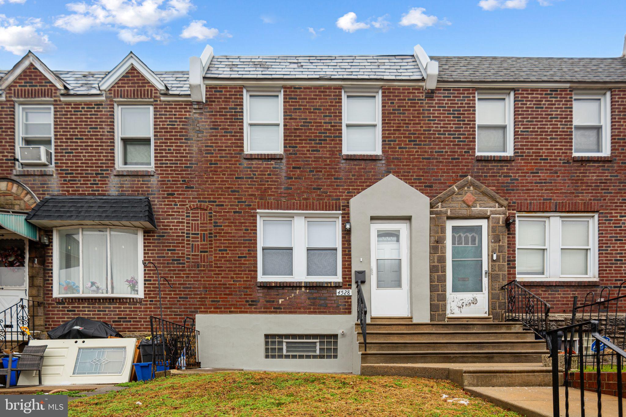 Charming brick townhouse facade.