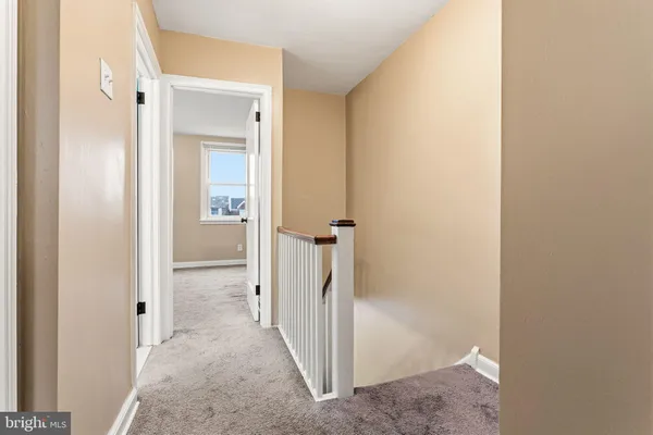 a view of a bathroom from a hallway