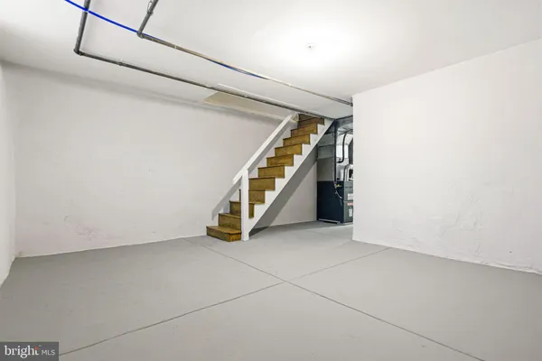 a view of an empty room with stairs