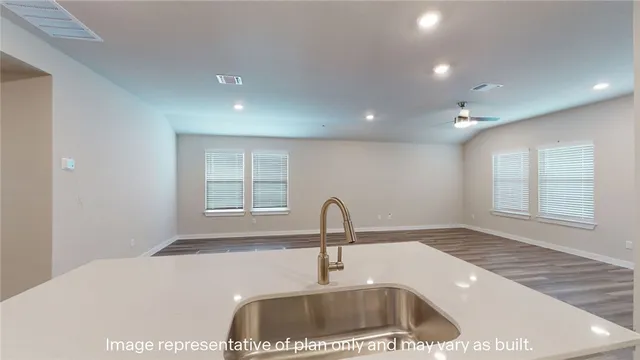 a kitchen with a sink and a window