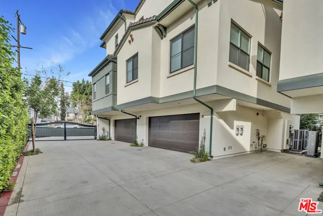 a front view of a house with garage