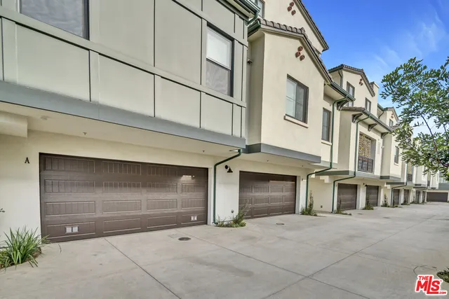 a view of a house with a street