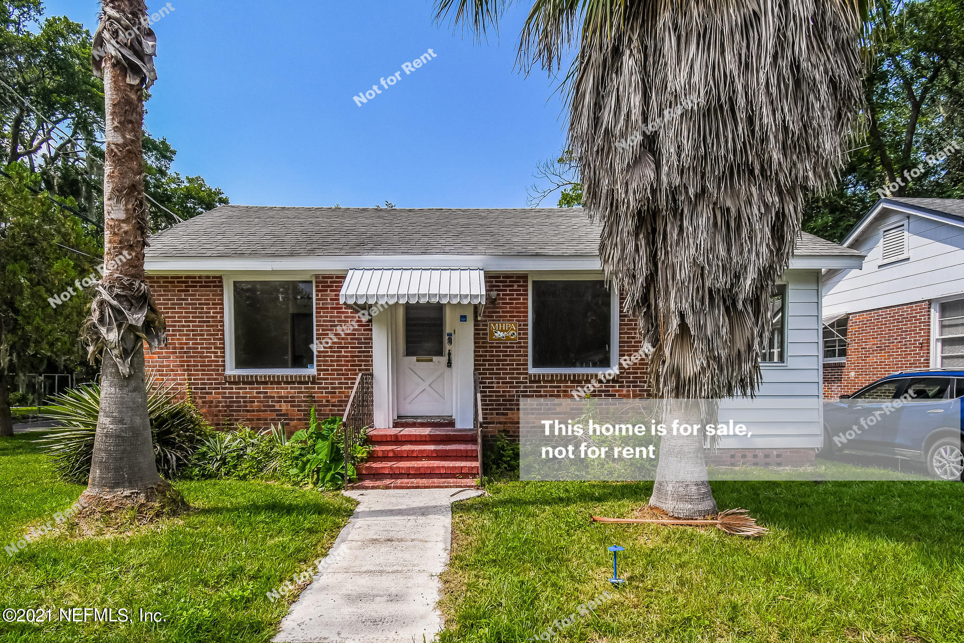 4659 Post Street Jacksonville, FL 32205 - Photo 1 of 25 a front view of a house with a yard