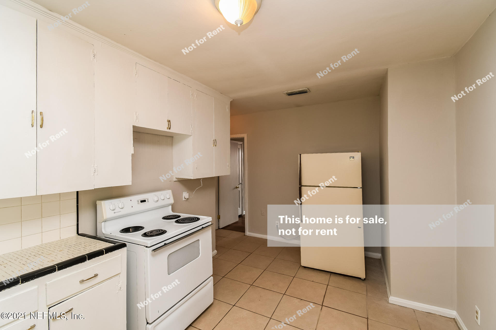 4659 Post Street Jacksonville, FL 32205 - Photo 11 of 25 a kitchen with a stove and a microwave