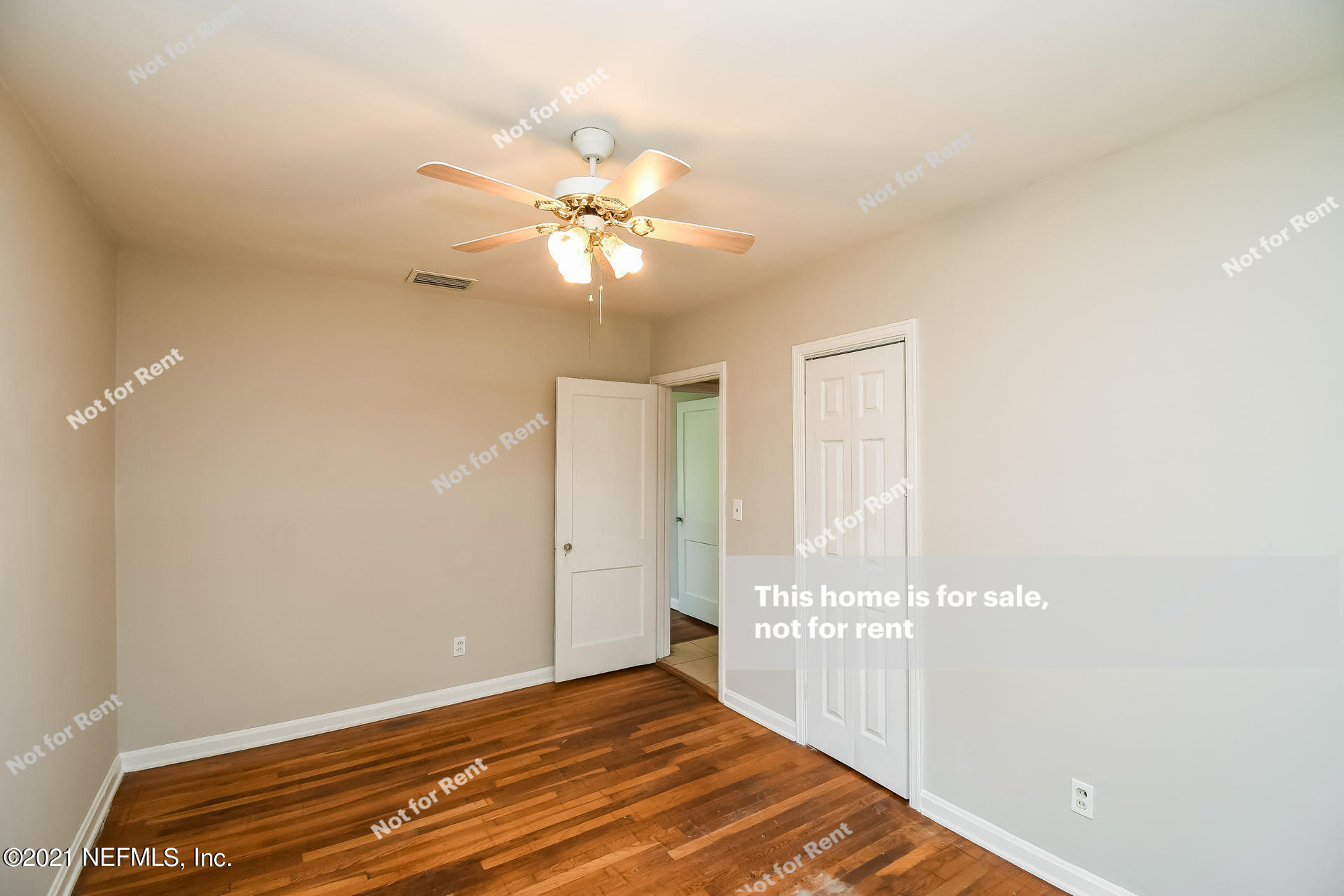4659 Post Street Jacksonville, FL 32205 - Photo 18 of 25 a view of an empty room with window and a ceiling fan