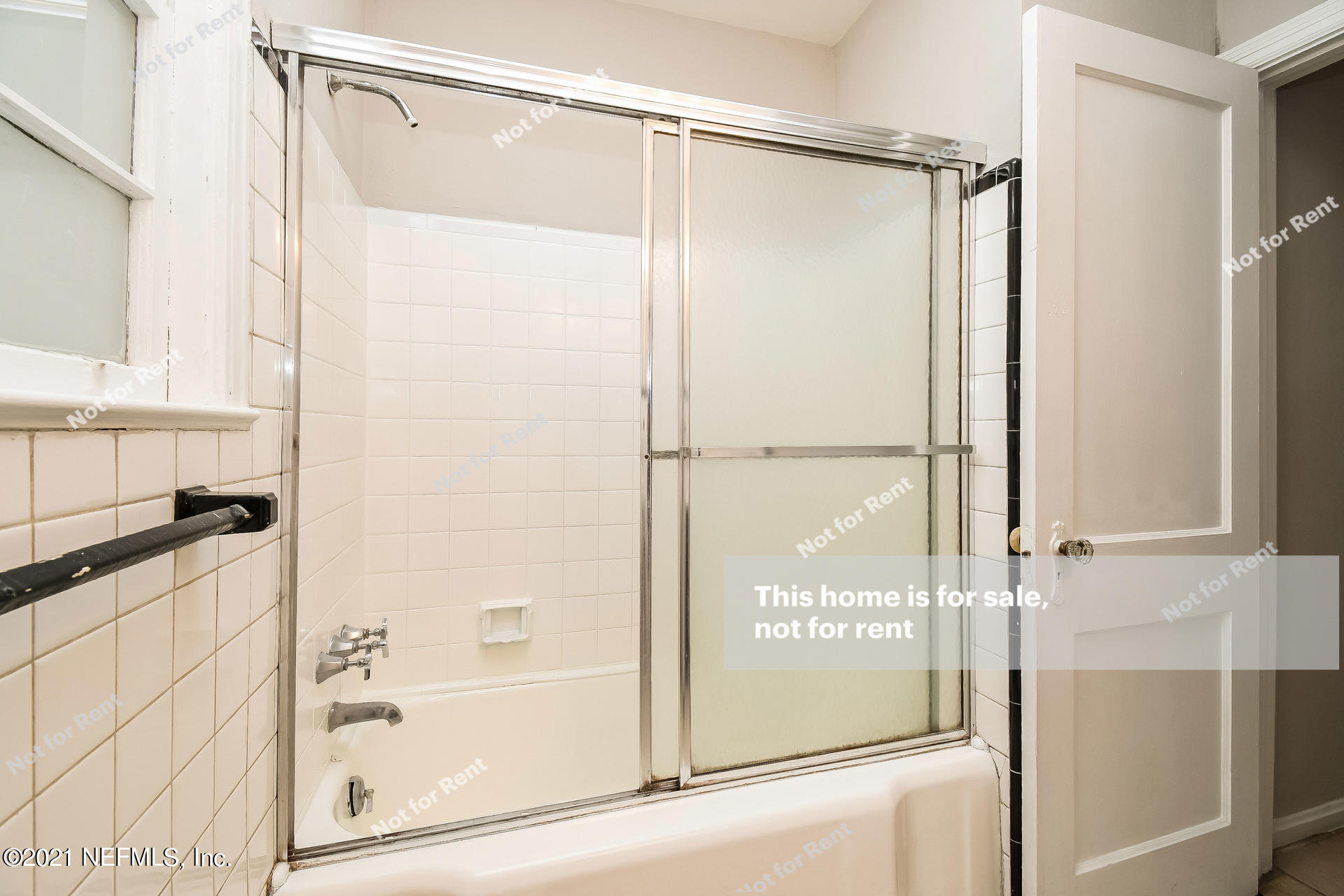 4659 Post Street Jacksonville, FL 32205 - Photo 20 of 25 a bathroom with a glass shower door