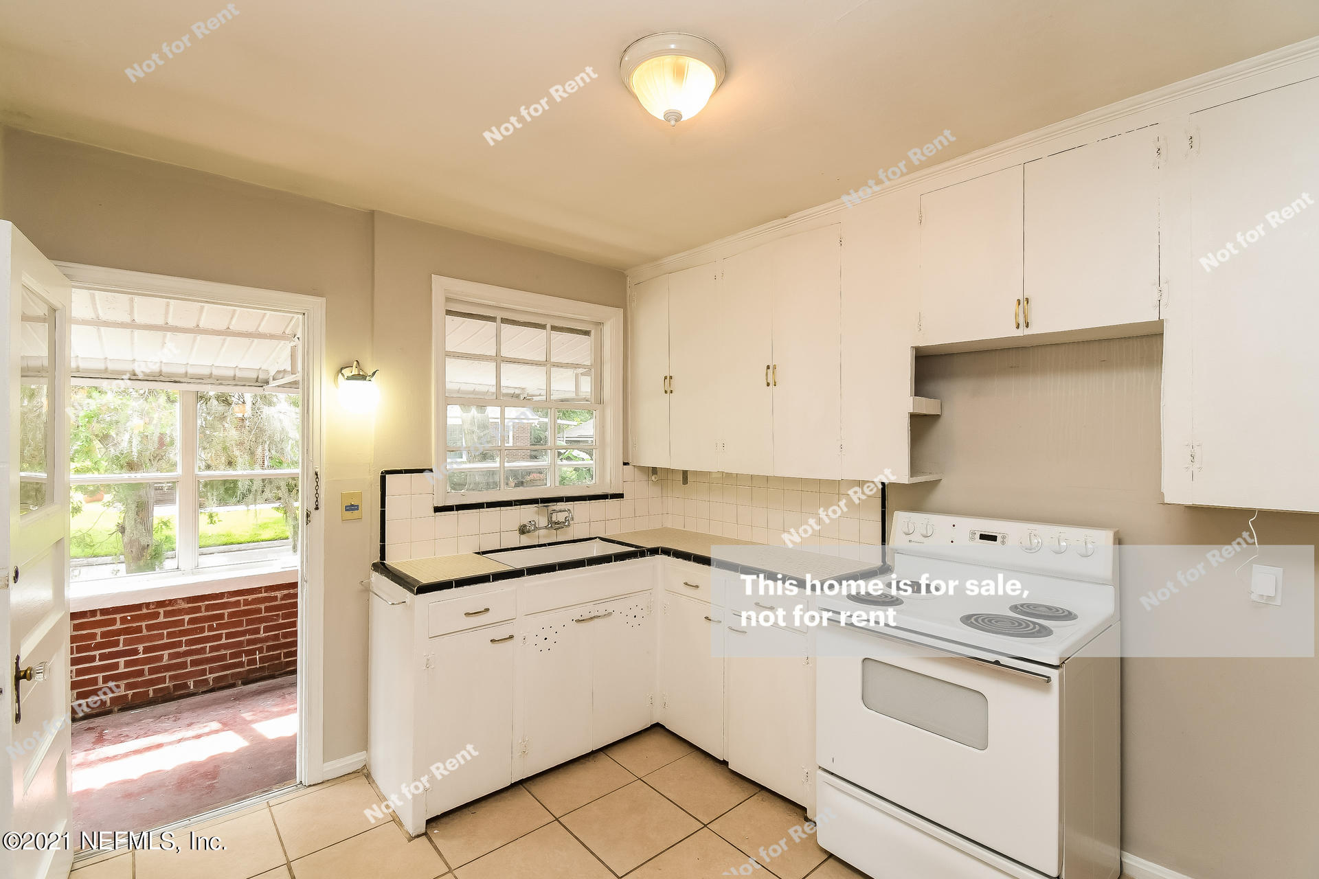 4659 Post Street Jacksonville, FL 32205 - Photo 2 of 25 a kitchen with a stove a sink and a window