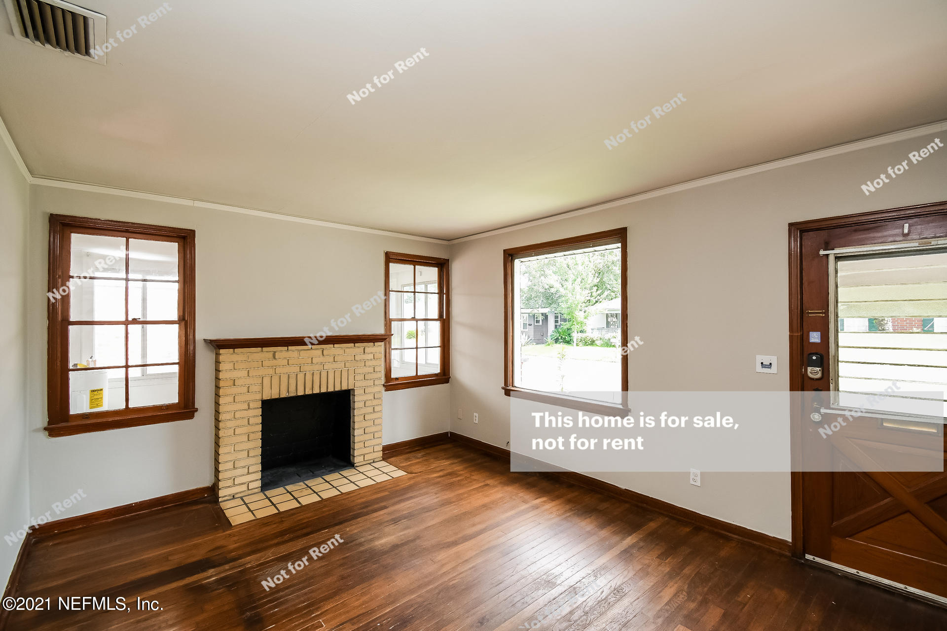 4659 Post Street Jacksonville, FL 32205 - Photo 3 of 25 a view of empty room with fireplace and wooden floor