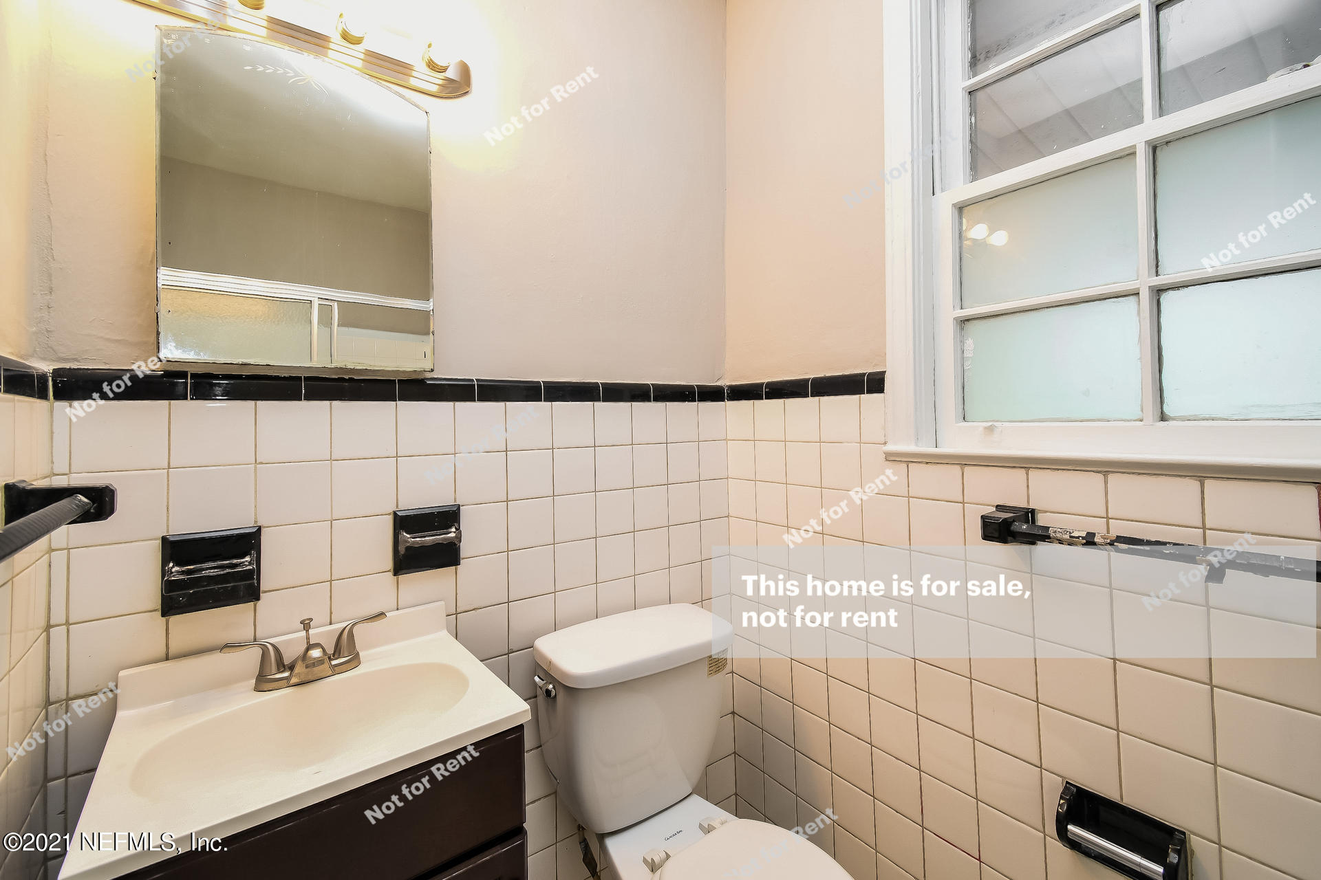 4659 Post Street Jacksonville, FL 32205 - Photo 5 of 25 a bathroom with a sink toilet and mirror