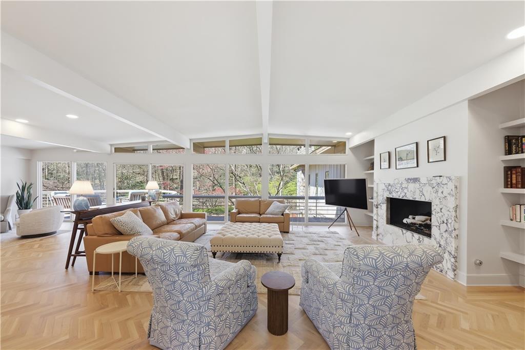 505 Hollydale Court Northwest Atlanta, GA 30342 - Photo 12 of 117 a living room with fireplace furniture and a large window