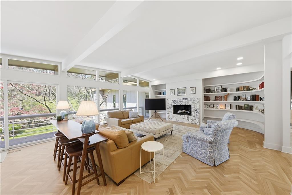 505 Hollydale Court Northwest Atlanta, GA 30342 - Photo 13 of 117 a living room with fireplace furniture and a flat screen tv