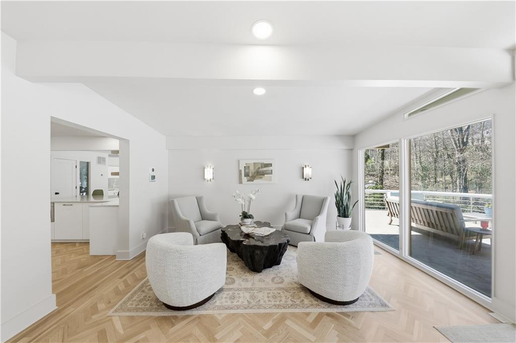 505 Hollydale Court Northwest Atlanta, GA 30342 - Photo 19 of 117 a living room with furniture and a large window