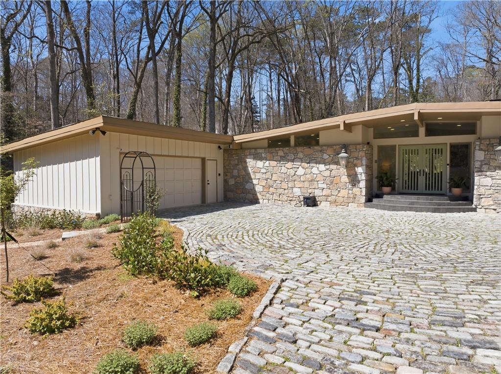 505 Hollydale Court Northwest Atlanta, GA 30342 - Photo 3 of 117 a view of a house with a yard covered in snow