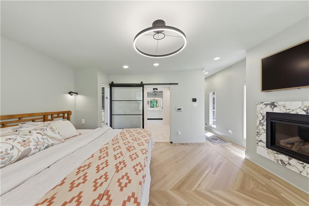 505 Hollydale Court Northwest Atlanta, GA 30342 - Photo 43 of 117 a bedroom with a bed and a flat screen tv