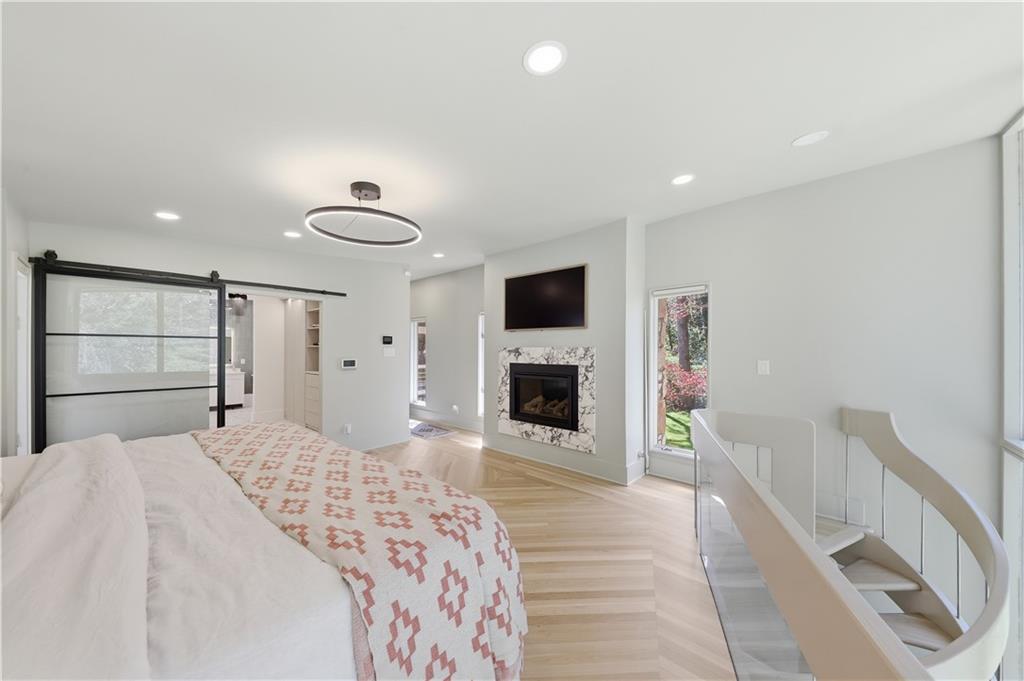 505 Hollydale Court Northwest Atlanta, GA 30342 - Photo 44 of 117 a bedroom with a bed and a flat screen tv