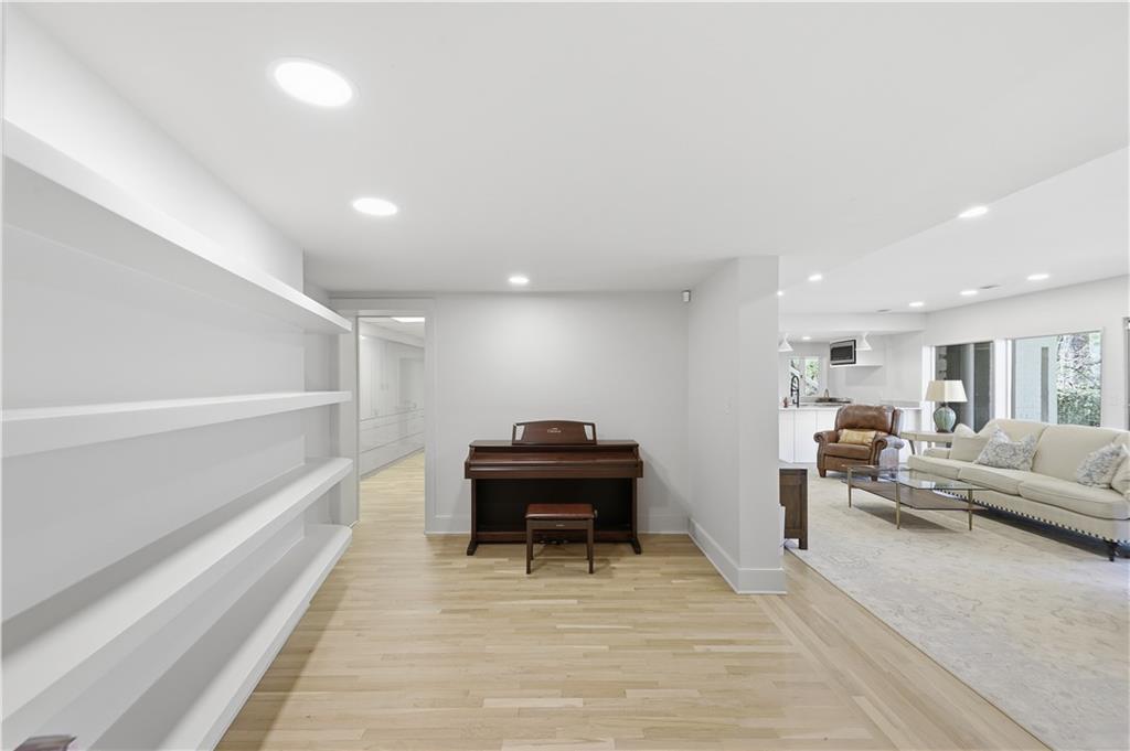 505 Hollydale Court Northwest Atlanta, GA 30342 - Photo 64 of 117 a living room with furniture and a piano