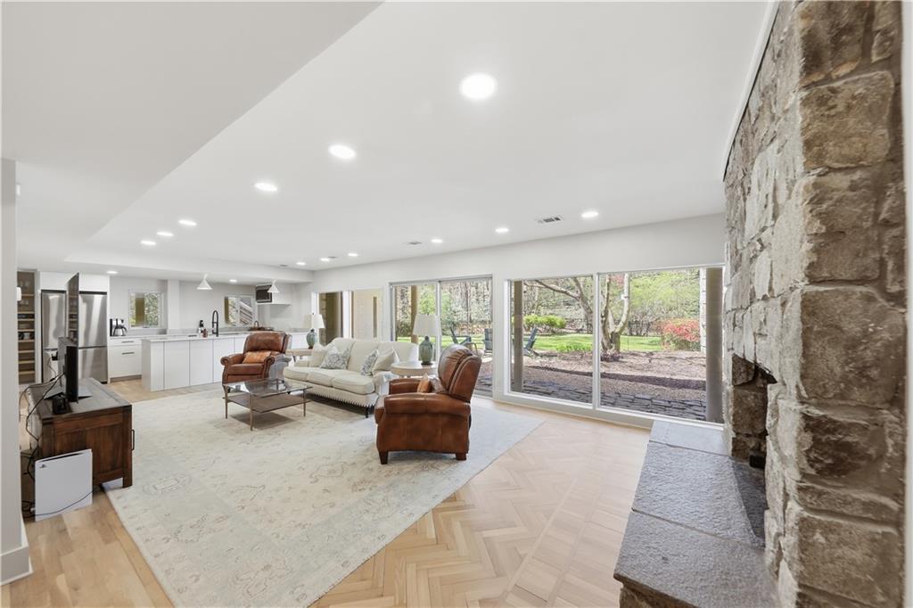 505 Hollydale Court Northwest Atlanta, GA 30342 - Photo 65 of 117 a living room with furniture and a floor to ceiling window