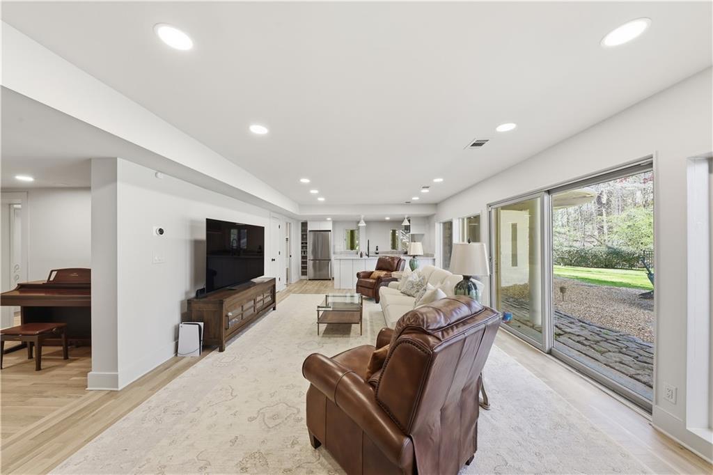 505 Hollydale Court Northwest Atlanta, GA 30342 - Photo 66 of 117 a living room with furniture and a flat screen tv