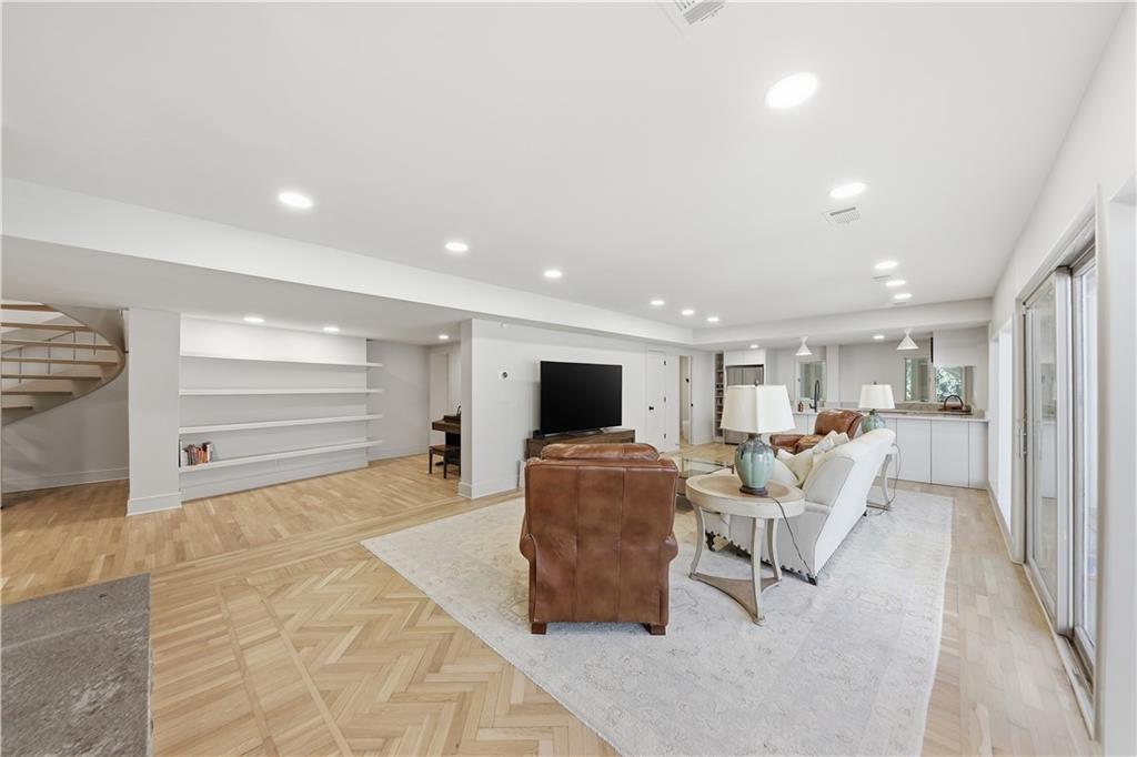 505 Hollydale Court Northwest Atlanta, GA 30342 - Photo 67 of 117 a living room with furniture and a flat screen tv