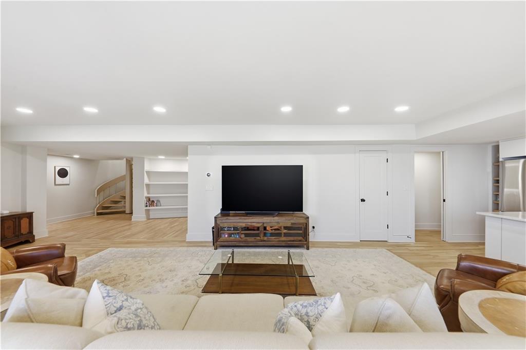 505 Hollydale Court Northwest Atlanta, GA 30342 - Photo 68 of 117 a living room with furniture and a flat screen tv