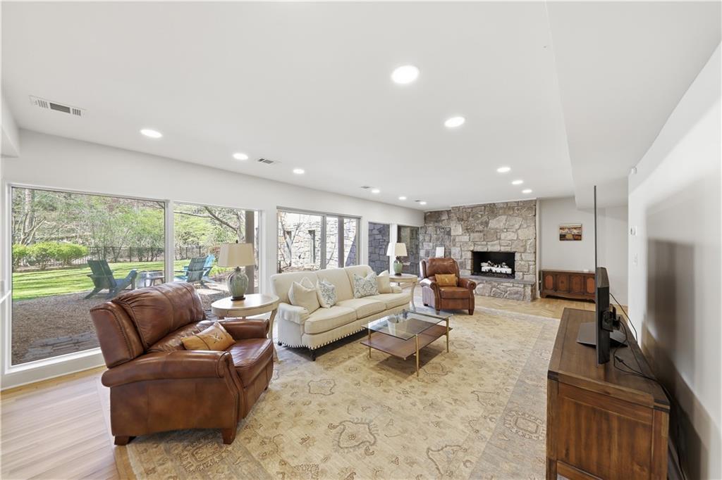 505 Hollydale Court Northwest Atlanta, GA 30342 - Photo 70 of 117 a living room with furniture and a flat screen tv