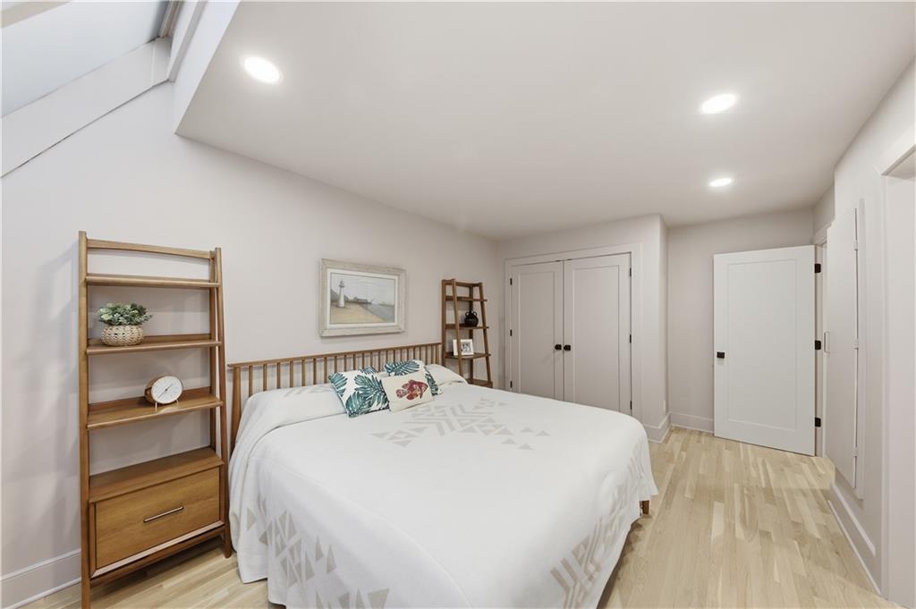 505 Hollydale Court Northwest Atlanta, GA 30342 - Photo 78 of 117 a bedroom with a bed and a window