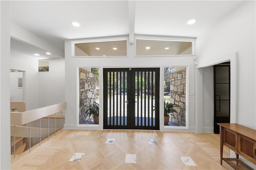 505 Hollydale Court Northwest Atlanta, GA 30342 - Photo 8 of 117 an entryway view with wooden floor and windows