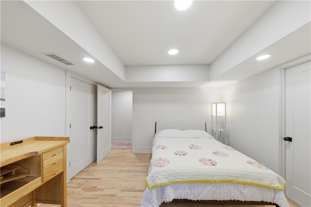 505 Hollydale Court Northwest Atlanta, GA 30342 - Photo 81 of 117 a bedroom with a bed and a refrigerator