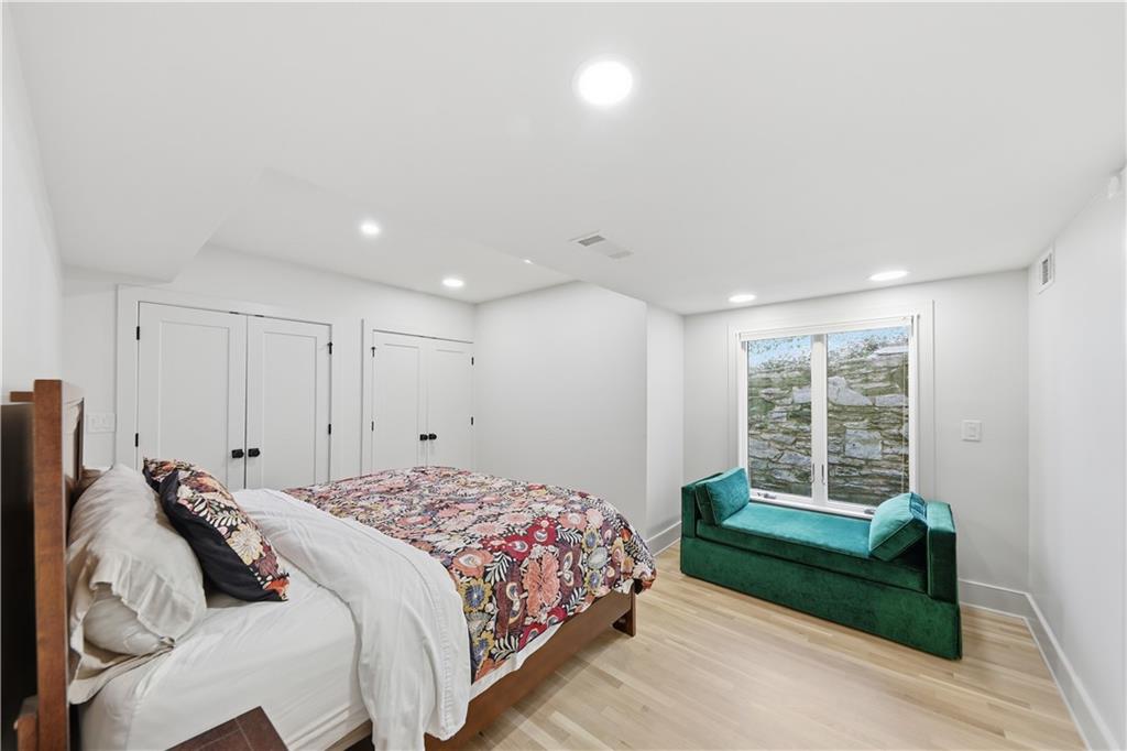 505 Hollydale Court Northwest Atlanta, GA 30342 - Photo 82 of 117 a bedroom with a bed and a window