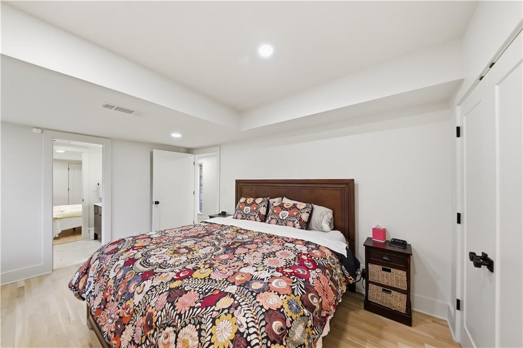 505 Hollydale Court Northwest Atlanta, GA 30342 - Photo 84 of 117 a bedroom with a bed and a closet